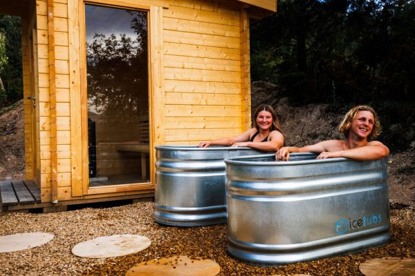Multiple sessions for sauna and cold plunge maydena bike park Male and female in ice baths at maydena bike park at wilderness wellness centre